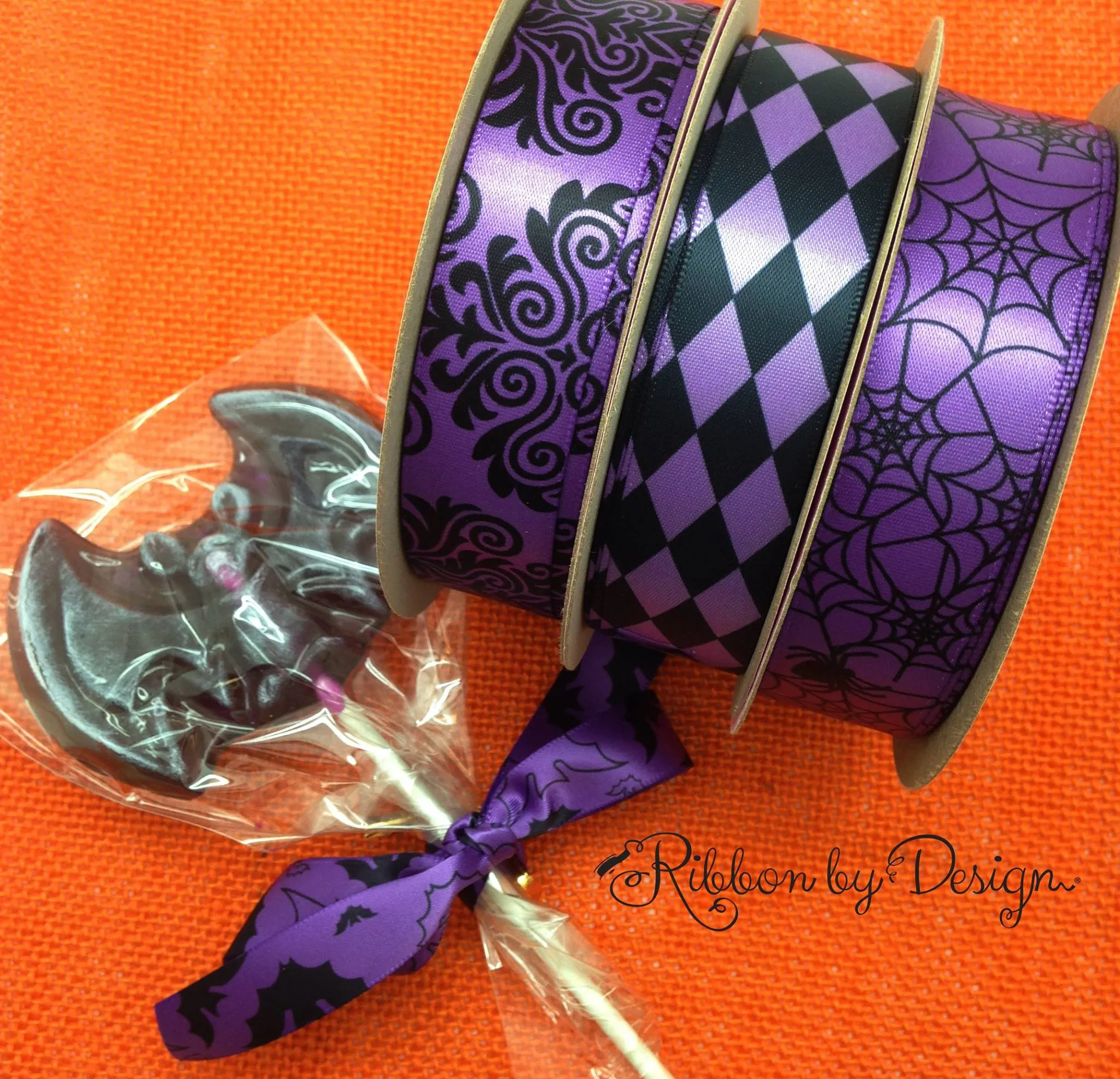 Spider Web Ribbon and Spiders in black on 7/8" orange, purple and pink single face satin